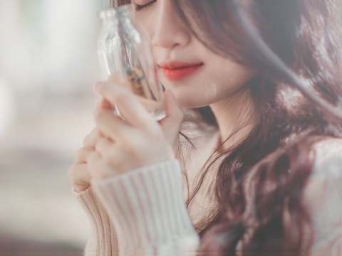 woman holding bottle