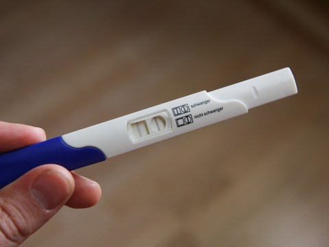 man holding test peck