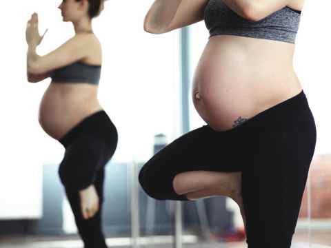 pregnant woman doing yoga